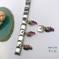 Detailed close-up of a purple grape charm on a modular stainless steel bracelet link - Model 122-Grape
