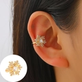 Gold snowflake ear cuff with sparkling zircons shown on ear and in detail closeup - Mid KC Gold - Shining Snowflake Style (G-101)