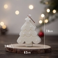 White Christmas tree scented candle on wooden base with festive warm lights - White Christmas Tree