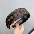 Close-up of a wide braided fishbone hairband in deep brown with realistic hair texture - Fishbone Braid / Black Brown