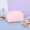 Pink Y2K heart embossed makeup bag with zipper closure for travel storage - Shell / Pink