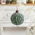 Green ribbed Christmas glass ball with white glitter snowflake finish and hanging loop - Dark Green Glass Ball