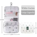 Hanging toiletry bag with green cactus pattern, mesh pockets, and top metal hook - White Cactus (Hanging Style)