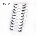 Close-up of 10 pairs of natural curly cat-eye false eyelashes in white tray XYJ15 - Curled Voluminous Style (XYJ15) / 10 Pairs Set