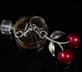Creative cherry keychain with dark red glitter fruit and silver leaves on a metal clasp - Red Cherry with Large Double Leaves (Matte Silver)
