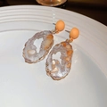 Vintage orange geode slice earrings with irregular gold edges on a ceramic plate - 23# Silver Needle - Yellow Geode Wrapped