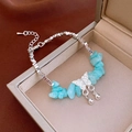 Silver bracelet with butterfly charm and blue opal stones on a beige jewelry box - Fresh Blue Crushed Stone Butterfly Pendant (58#)