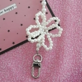 Handmade white pearl flower charm strap with silver lobster clasp on pink background - 110cm / Beige