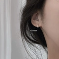 Minimalist 15mm gold-finished geometric hoop earrings worn by a model for a chic look - 15mm - White Gold Earrings