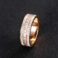 Luxurious wide titanium steel ring with triple-row clear zircons on black background - US 9 / Rose Gold