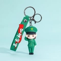 Cartoon female soldier keychain with green uniform, salute pose, and silicone wrist strap - Army Salute Female Soldier