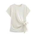 Detail of cream waffle-knit t-shirt showing soft texture and side-tie knot detail - S / Tops / Beige