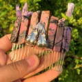 Handmade metal hair comb featuring pink and black crystals with silver bird skulls - Rhodochrosite + Silver Crow Skull