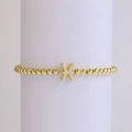 Pisces zodiac charm bracelet with 18k gold plated round beads on a display stand - Pisces