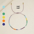 Handgewebtes Wassermann Sternzeichen Armband mit bunten Perlen und lila Nylonschnur - Wassermann (MI-Serie)
