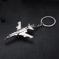 Silver alloy jet fighter model keychain with metallic plating on black background - Airplane 5938 Silver
