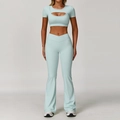 Two-piece yoga set with mint green cutout short sleeve top and flare leggings - S / Top And Bottom / Short Sleeve + Flare Pants / Cream Green