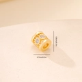 Macro shot of 0.8cm gold metal bead with zircon inlay and detailed hollow patterns - Gold Hollow Pattern