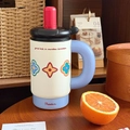 Off-white ceramic insulated tumbler with light blue base and bold semi-circular handle - Rainbow Floral-Ceramic-900ML