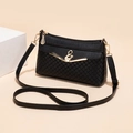 Elegant black crossbody bag with woven texture and golden bird pearl buckle detail - Black