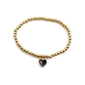 Golden beaded bracelet with a black enamel heart pendant on a clean white background - Black