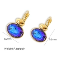 Detail of 16mm gold oval earrings with blue gems and secure lever-back closure - Sapphire Blue