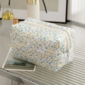 Quilted floral makeup bag in white fabric with small blue flowers and zipper closure - New Blue Floral
