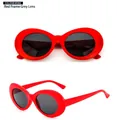 Retro oval sunglasses with bold red frame and gray lenses in a stylish 60s vintage design - Red Frame Grey Lens