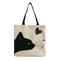 Detail of a beige canvas tote bag with a black cat watching a butterfly and heart print - Black Cat and Butterfly