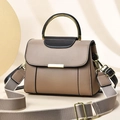 Chic beige leather handbag with gold circular handle and wide fabric crossbody strap - Khaki