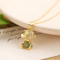 Gold-plated bear pendant necklace with green and white zircons in a warm lifestyle setting - Green Bear Style(23647)