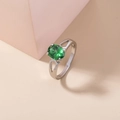 Elegant silver ring featuring an oval green gemstone with micro-set zircon accents - Adjustable Open / Green Oval Gemstone/Bifurcated Setting