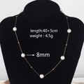 Detail view of pearl necklace on neck with size specs 40+5cm length and 8mm pearl diameter - Round Pearl Necklace (8mm)