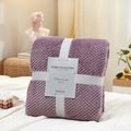 Folded purple pineapple plaid flannel blanket with decorative ribbon for office use - Bean Paste Purple