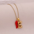 Detail of gold letter E pendant with crystals and red chili charm on necklace - Letter E(E)