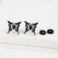 Macro view of matte black stainless steel butterfly studs with detailed cutout patterns - Butterfly / Black