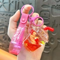 Cute Capybara bubble tea liquid keychain with pink glitter strap for bags and keys - Milk Tea Cup - Red