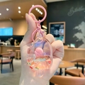 Roze cartoon sleutelhanger in de vorm van een ijsje met glittervloeistof en bedeltjes - Fruitijsje / Roze