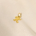Polished gold minimalist abstract person pendant accessory on beige silk fabric - Letter-K
