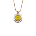 Golden smiley face necklace for women with sparkling stones and enamel on white background - Yellow