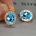 Oval blue gemstone hoop earrings with sparkling halo set in rose gold finish - Rose Gold Plated Aquamarine Zircon