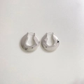 Polished silver stainless steel C-shaped earrings on a beige leather texture background - Glossy C-Shape Style (PEK2039)