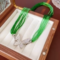 Multi-strand green beaded bracelet with silver butterfly clasp in a wooden box - No.12 Bracelet-Green Butterfly