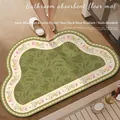 Cloud-shaped olive green bath mat with floral borders on light wood flooring - American Cloud Style - F