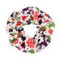 Close-up of a white Christmas scrunchie with colorful holiday patterns and fabric texture - White