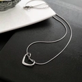 Silver titanium steel necklace featuring a hollow heart pendant and sleek snake chain - Silver