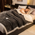 Deep grey quilted milk velvet blanket with warm off-white lamb wool lining and wavy stitching - Dark Grey + White Lamb Cashmere