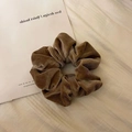 Detailed close-up of coffee brown velvet scrunchie showing soft pleated texture and sheen - Large Velvet / Light Coffee
