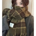 Detail of brown and yellow plaid scarf featuring soft fringe and stitched brand label - 230cm / Army Green