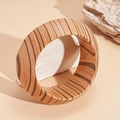 Detailed view of wide wooden grain bangle with organic brown tree ring textures on a stone - Brown Annual Ring Texture Style